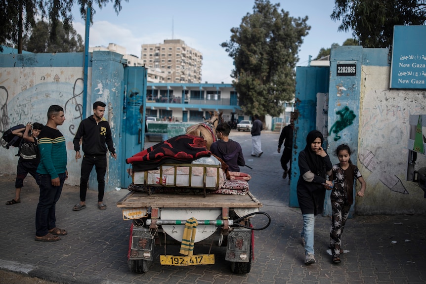 Palestinians take refuge in a UN school