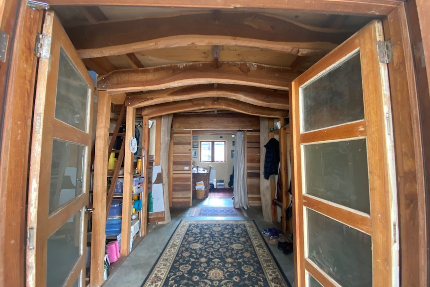 What looks like a cabin, with wood and roof of foyer room made from wood 