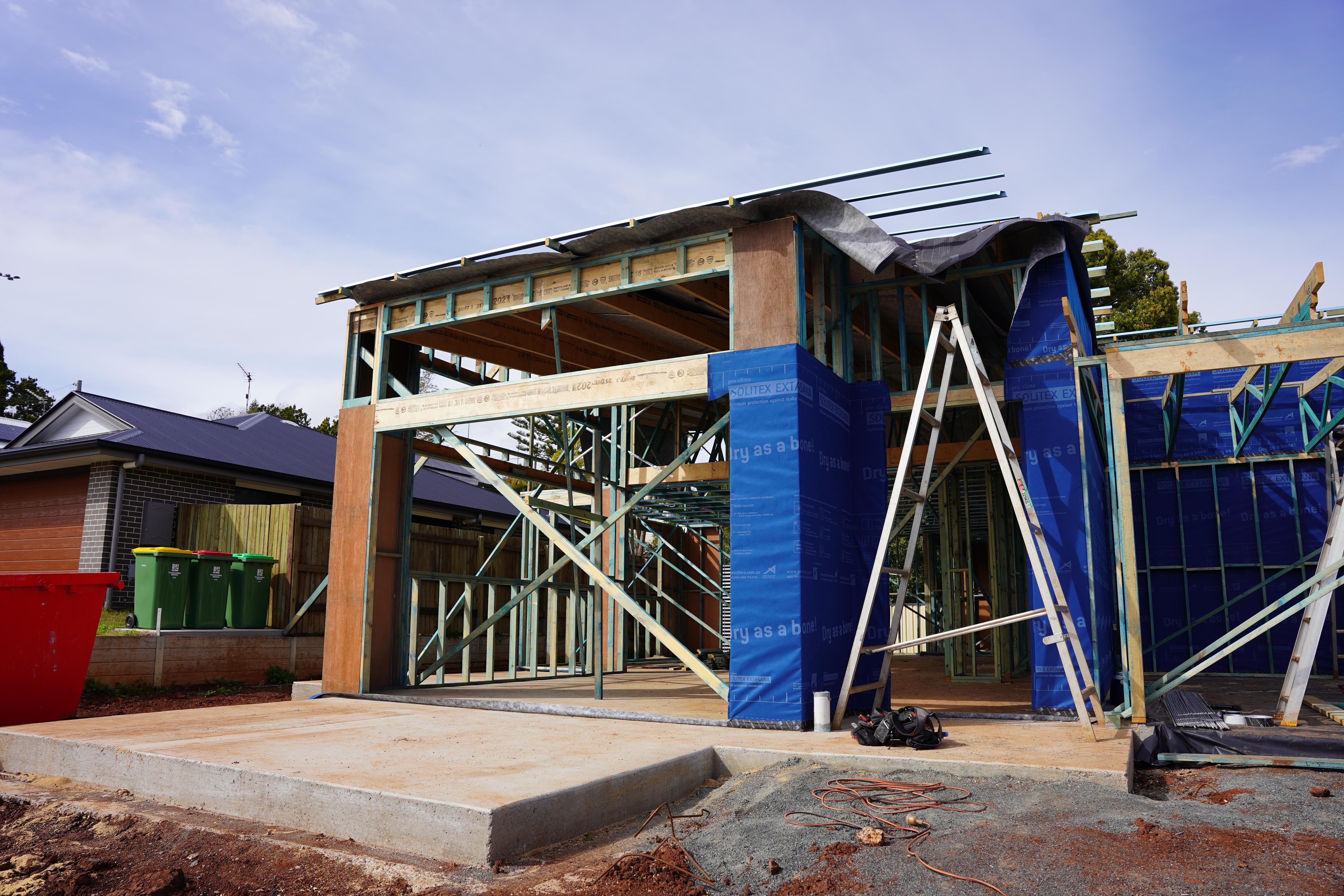 A house frame with some wrapping on it