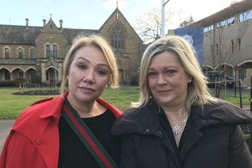 Sam Baker and Janet Mitchell stand outside Presentation College Windsor.