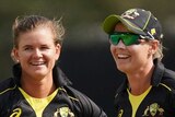 Australia bowler Jess Jonassen (left) and captain Meg Lanning smile in the field during a Twenty20 cricket match against India.