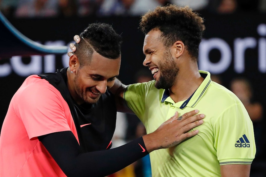 Nick Kyrgios (L) and Jo-Wilfried Tsonga embrace following their epic third-round match.
