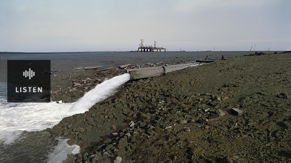Outflow of wastewater from paper mill into the Swale, Kent. . Has Audio.