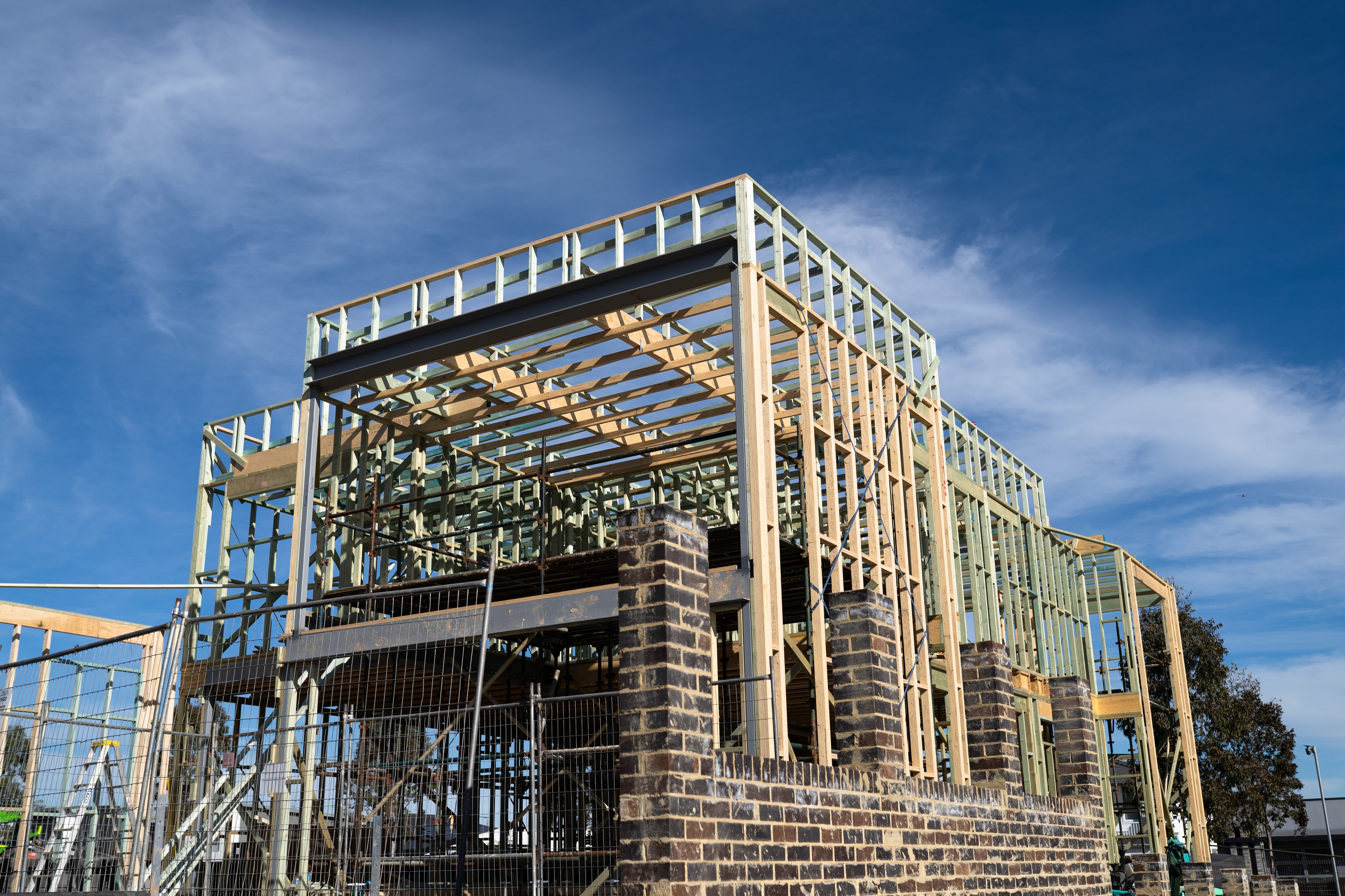 Houses under construction on a bright, sunny day