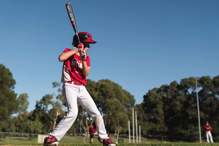 Little league player Jacob Horsley Braydin Horsley holds up a bat.