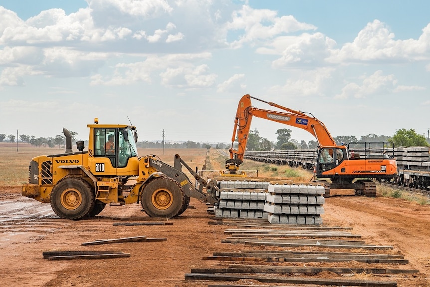 Heavy machinery moving sleepers along the inland rail route.