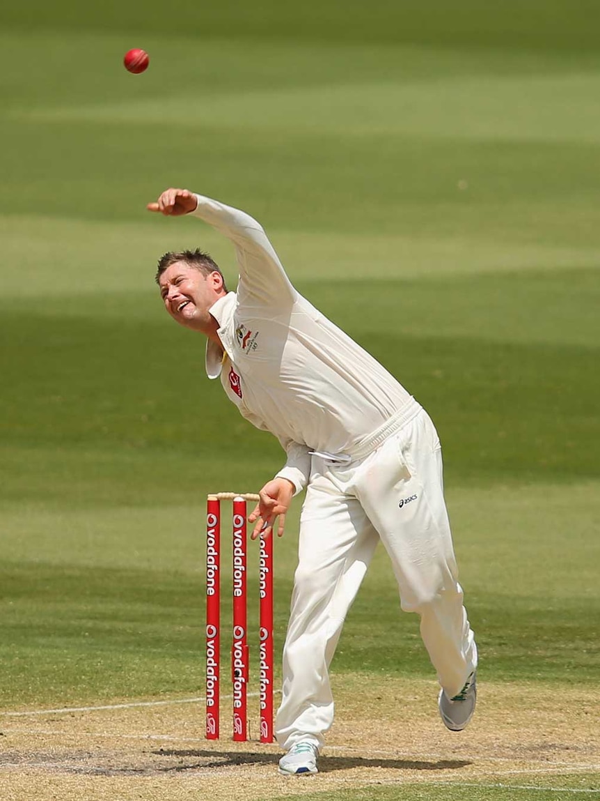 Captain courageous... Michael Clarke rolls the arm over on day three.