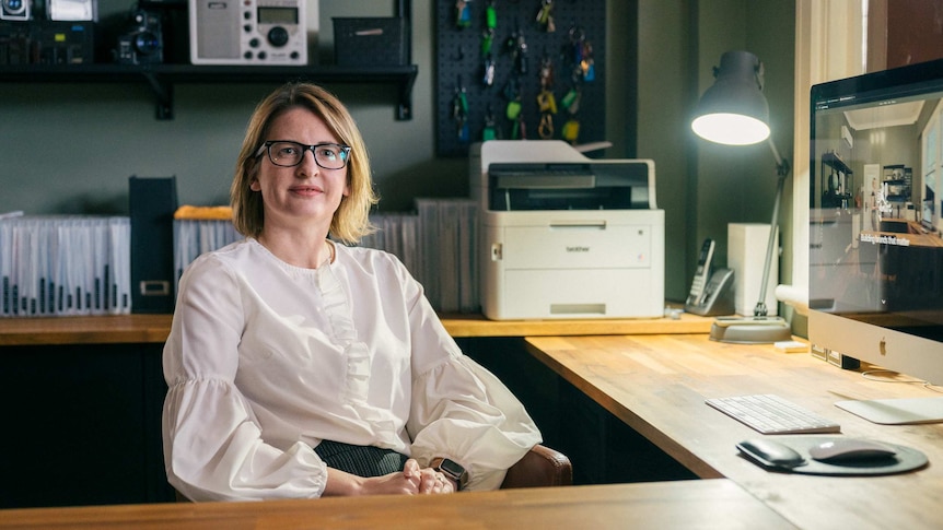 Sarah Stanley sitting at an office desk