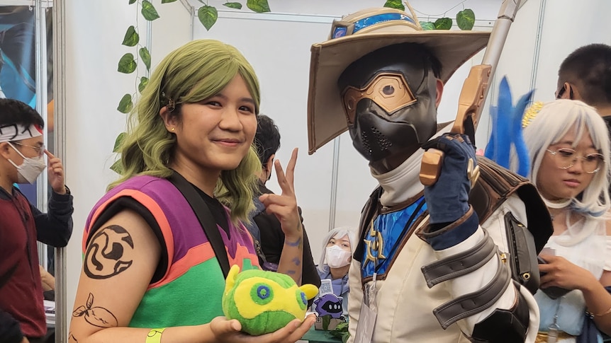 Two people wearing costumes from Japanese characters during cosplay party in Jakarta