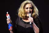 Adele accepts the British Female Solo Artist award at the BRIT Awards.
