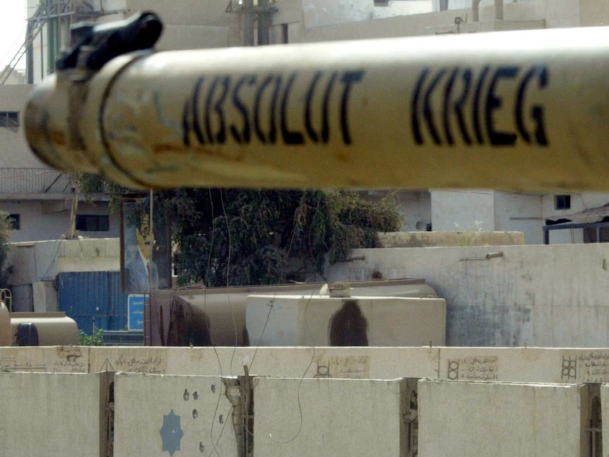 Photograph of the body of a young boy in Iraq in 2003 who was killed as he was riding his bicycle in Karbala.