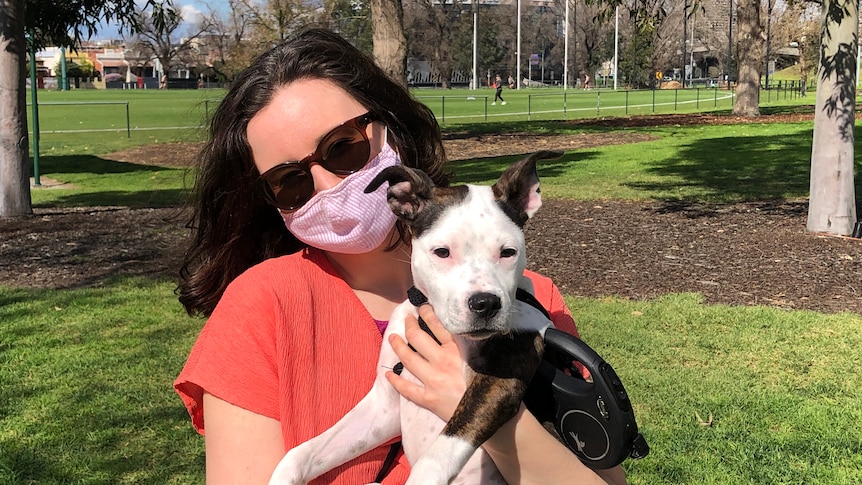 Meg Watson and her four-month-old puppy Ruby in the park.