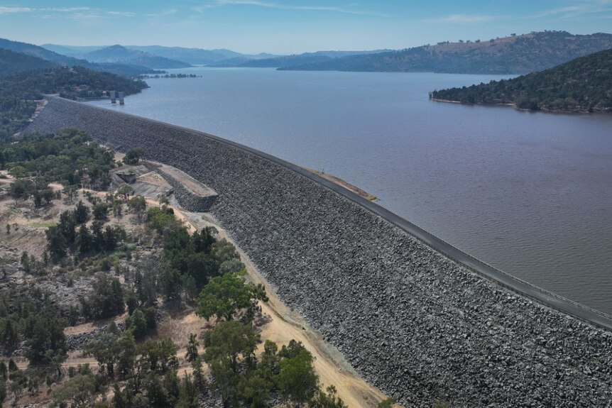 An aerial shot of a large dam wall.
