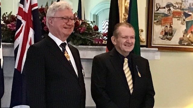 Queensland Governor Paul de Jersey and Paul Maguire stand together
