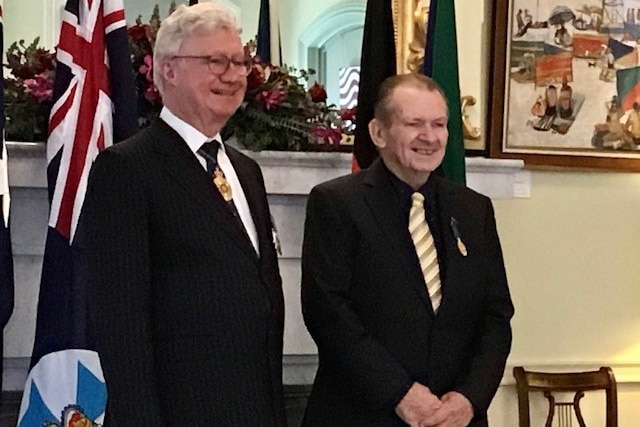 Queensland Governor Paul de Jersey and Paul Maguire stand together