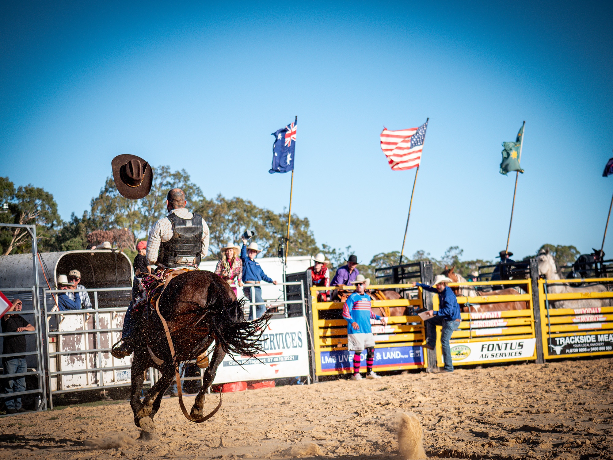 A cowboy loses his hat during a saddle bronc run. 