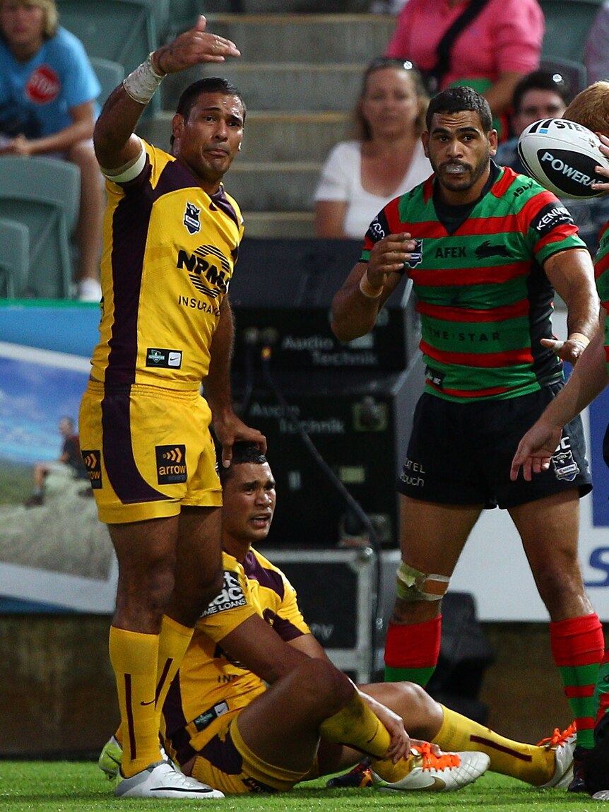 Send help ... the concern is evident on Justin Hodges' face as he calls for trainers to attend to Yow Yeh's leg.