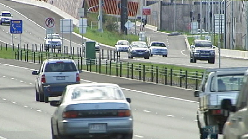 A car driving down a toll way