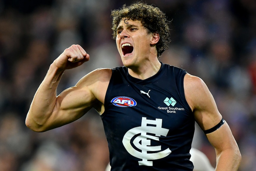 Charlie Curnow pumps his right fist during Carlton's AFL win over Essendon.
