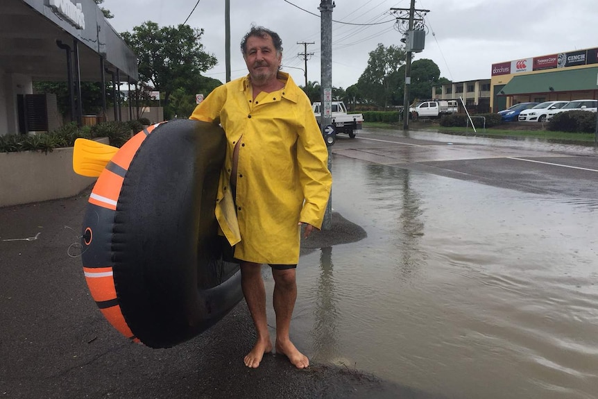 George from Hermit Park in flooded Townsville is moving food and fuel to his son’s house down the road.