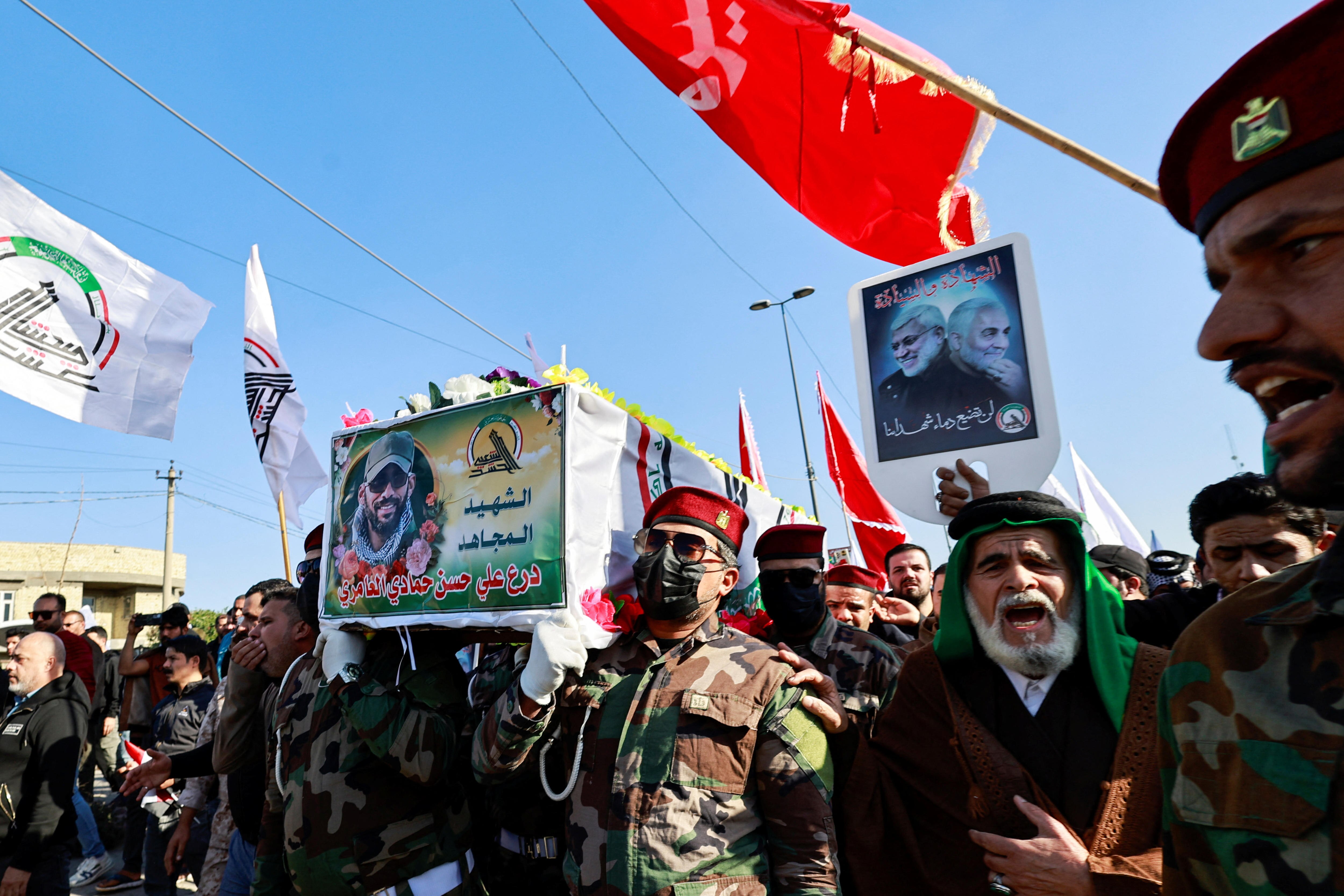 People carry the coffin of an Iraqi Kataib Hezbollah fighter who was killed in a US airstrike.