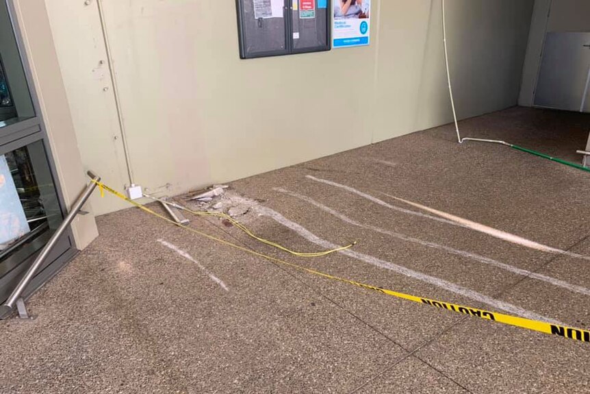 Scrape marks in concrete at scene where a person used a front-end loader to steal an ATM.