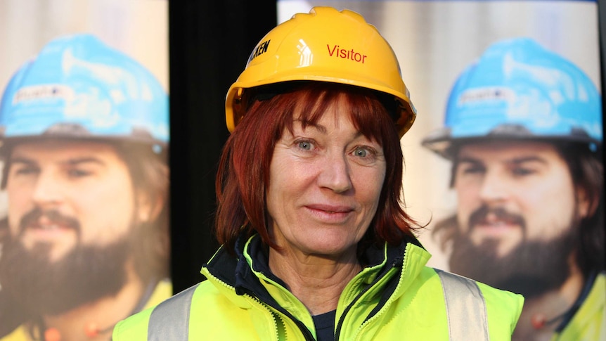 Molly Sandford wearing a high vis vest and hard hat.