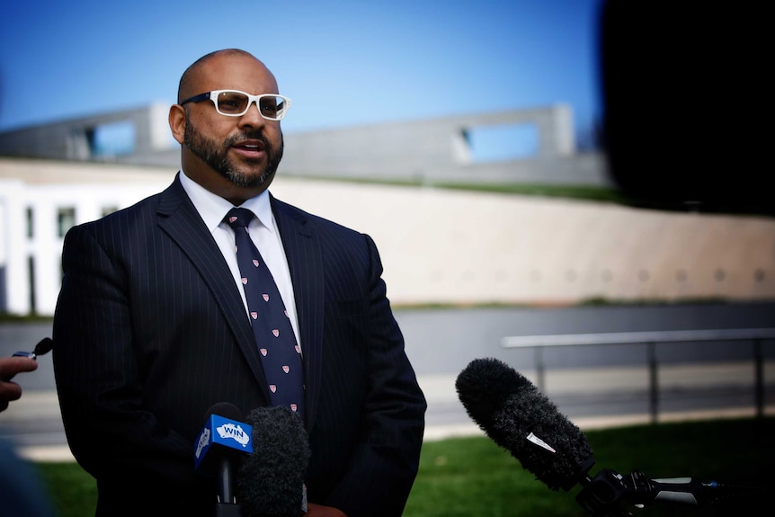 Aviation Lawyer Joseph Wheeler and pilots speak out the front of Canberra's parliament house.