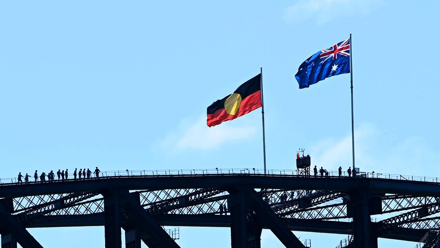The Aboriginal flag and the Australian flag atop the Sydney Harbour Bridge