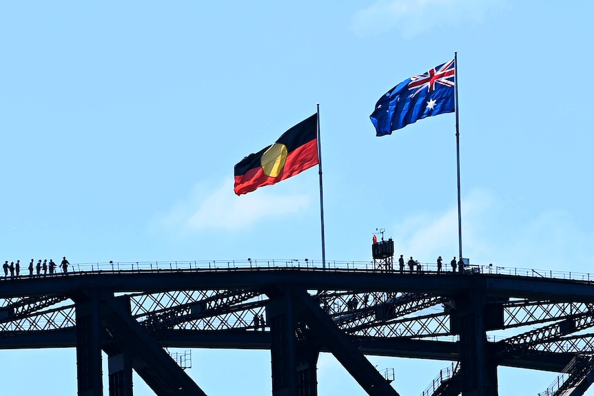 The Aboriginal flag and the Australian flag atop the Sydney Harbour Bridge