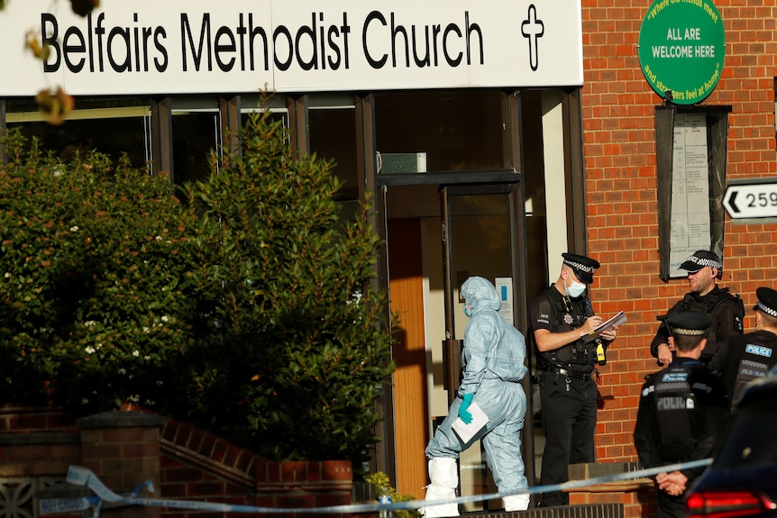 Police guard the entry to the Belfairs Methodist Church.