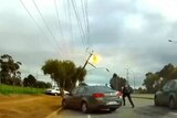 Police dashcam footage of car bringing down power lines