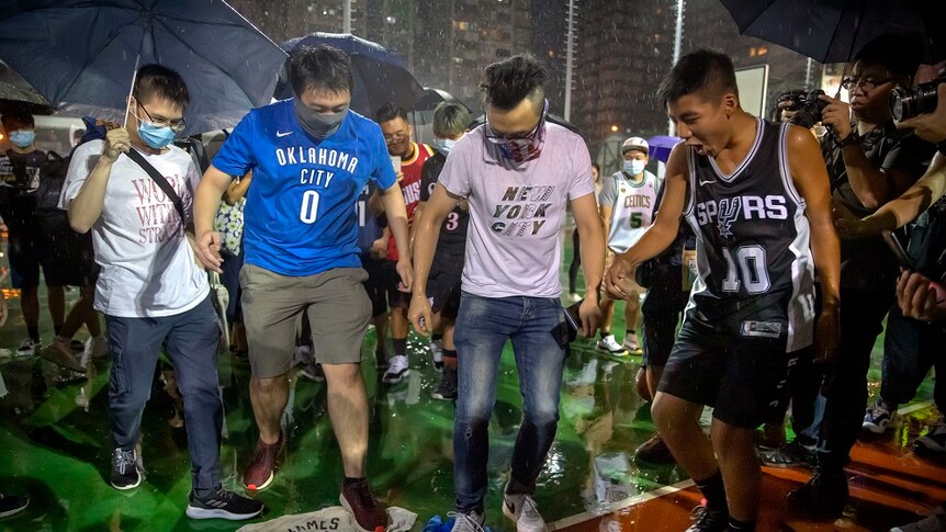 Protester in Hong Kong trample a jersey on the street