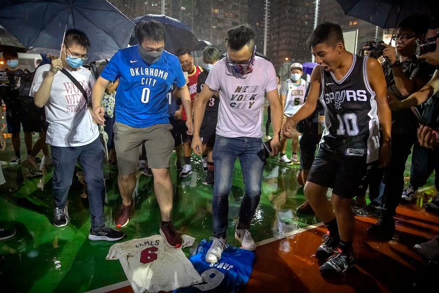 Protester in Hong Kong trample a jersey on the street