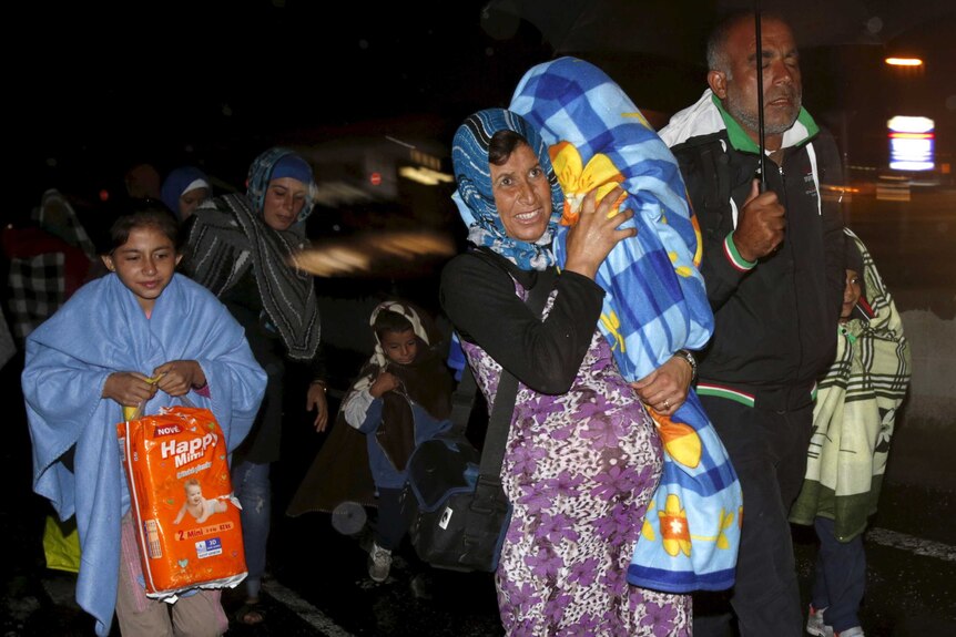 Asylum seekers arrive at the Austria-Hungary border