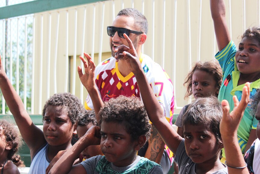 Brisbane Broncos player Benji Marshall with Indigenous children at Coen