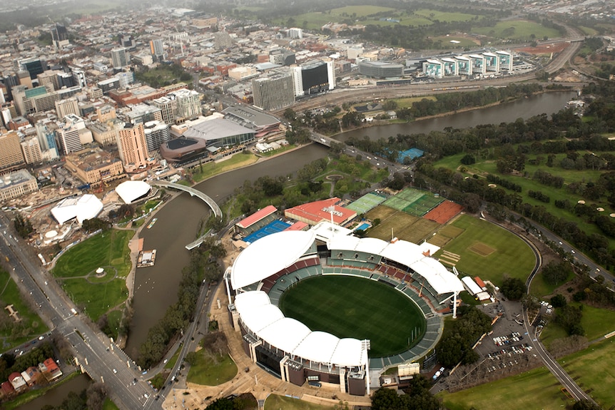 Adelaide Oval from above with the new Royal Adelaide Hospital in the background.