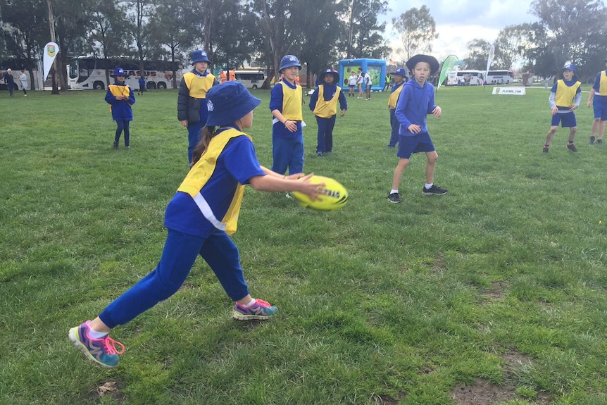 children play silent touch football as part of the Silent Sport Challenge.