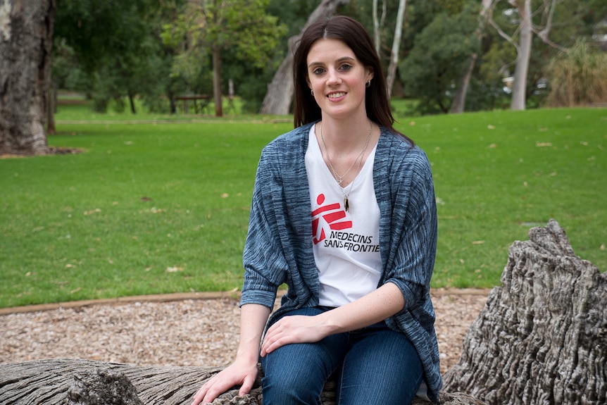 Lisa Altmann sits on a log, back at home in Adelaide.
