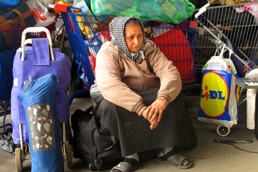 A Roma woman ponders where to go next after being evicted from her home.
