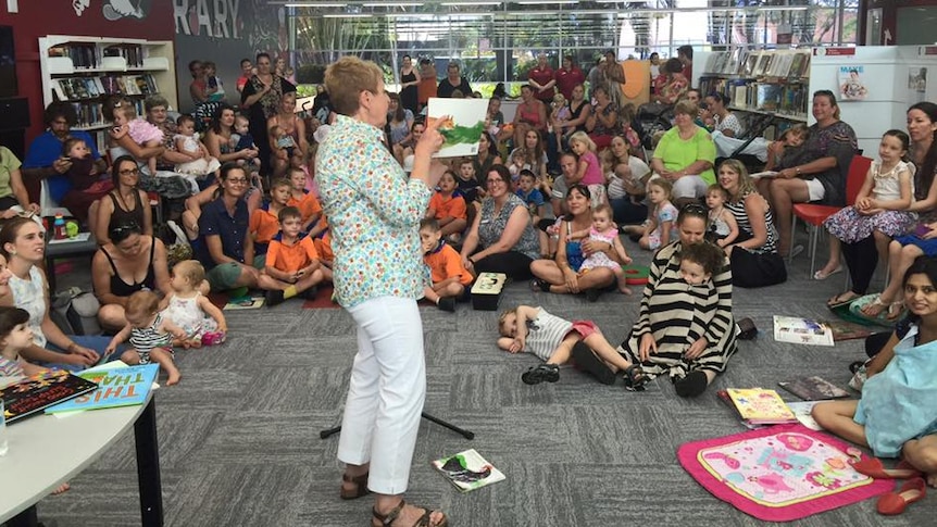 Author Mem Fox reads to the crowd during her visit to the Bundaberg Library.