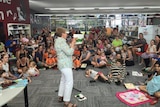 Author Mem Fox reads to the crowd during her visit to the Bundaberg Library.