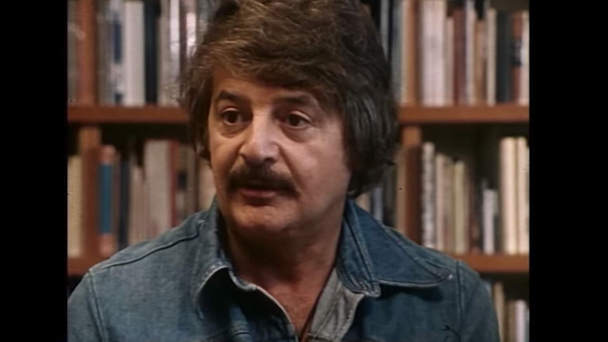 Composer Peter Sculthorpe in 1979 wearing a blue denim shirt.