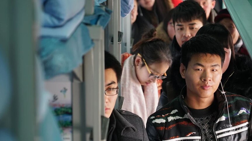 Chinese lining up on train for NY