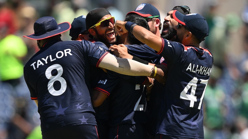 USA players embrace as they celebrate defeating Pakistan at the men's T20 World Cup.