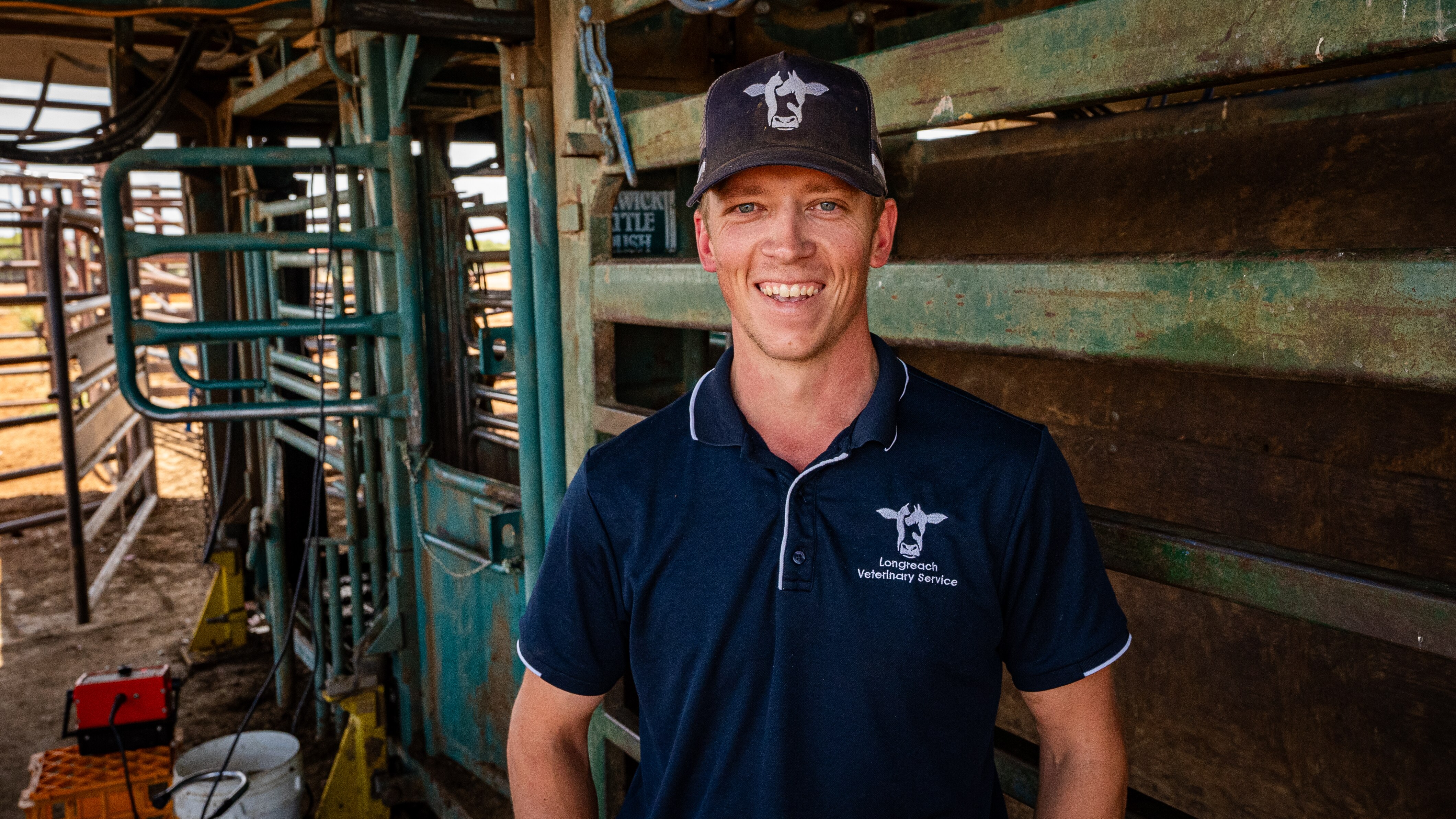 man standing near the cattle yards