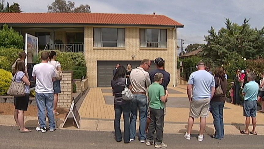 People attending a house sale auction in Canberra (February 2012).