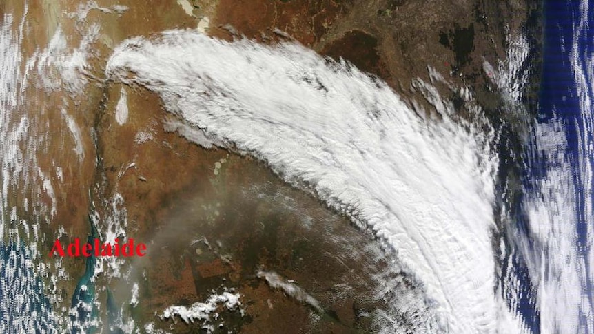 Cold front pulls ash cloud over Australia