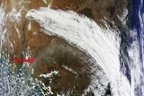 Cold front pulls ash cloud over Australia
