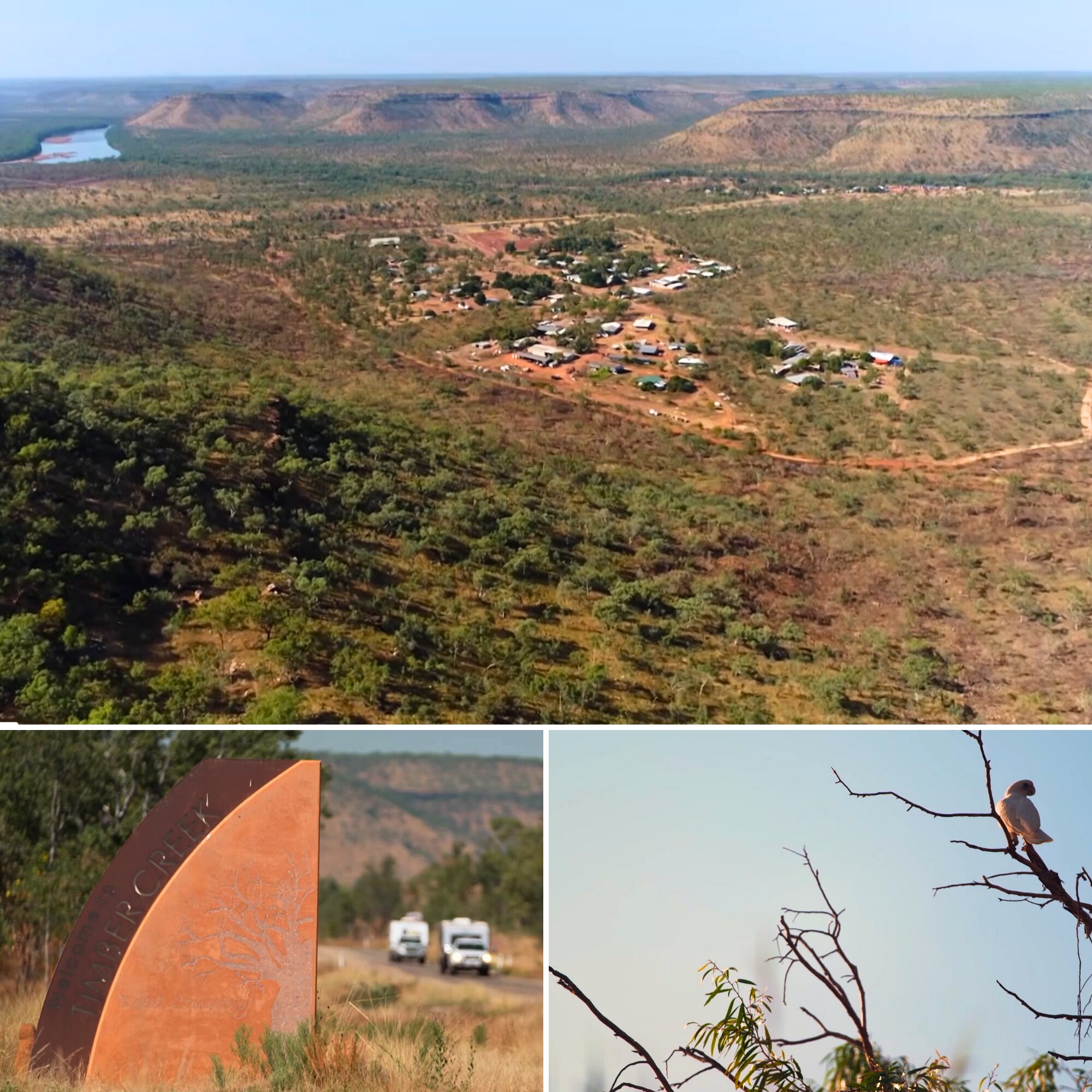 Aerial photo of tiny township surrounded by red dirt and scrubland positioned between weathered ranges and a river